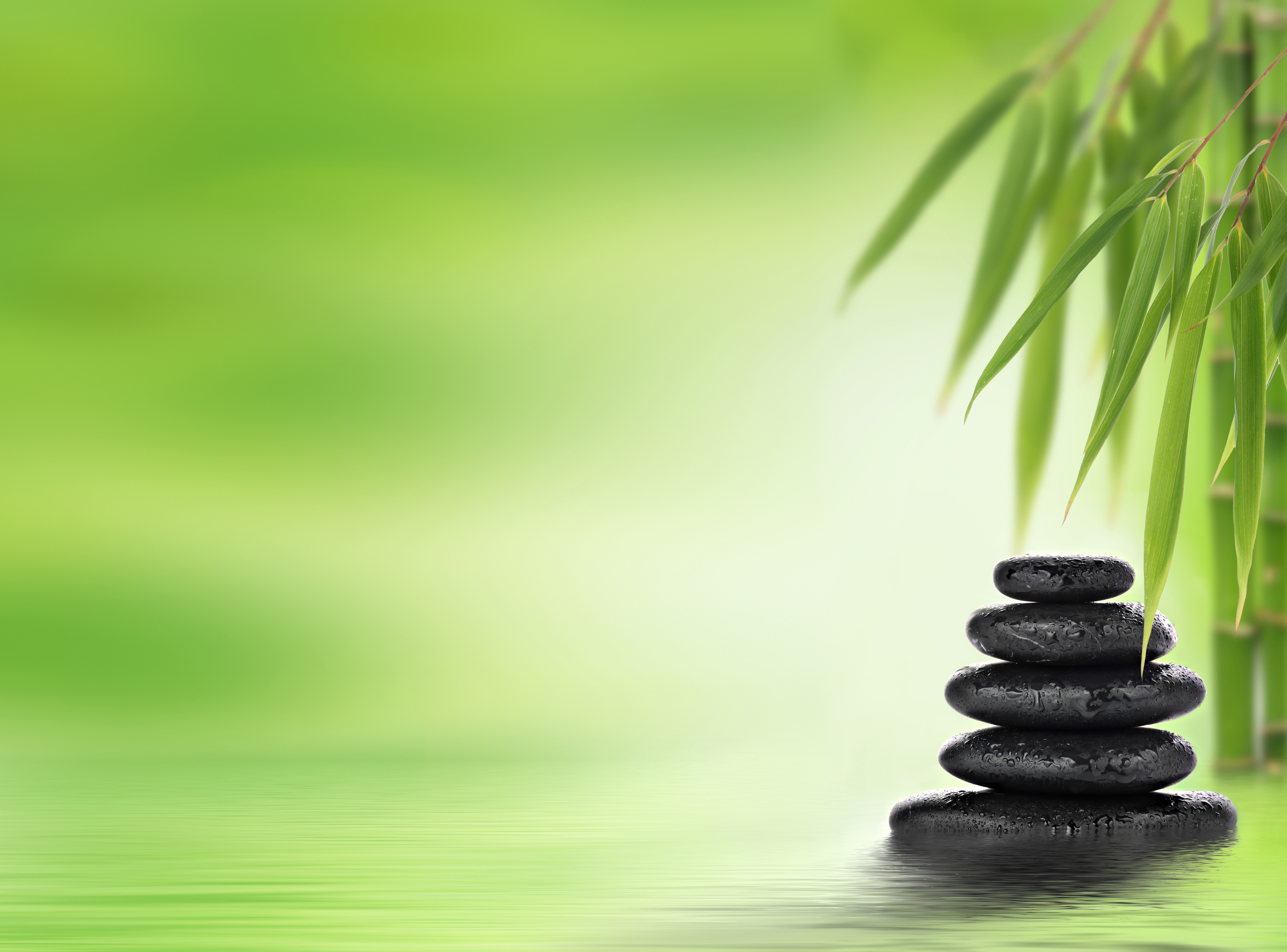 Spa Background With Stacked Massage Stones And Bamboo Ambrosia